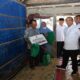Penyerahan bantuan rehab rumah tidak layak huni dan paket sembako kepada warga di dalam rumah sederhana