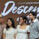 Sutradara Hanung Bramantyo bersama para pemeran berdiri di depan latar bertuliskan Descendants of the Sun
