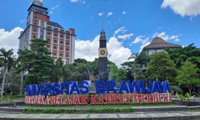 Salah 1 Inovasi Kulit Pisang Mahasiswa UB Jadi Deterjen Cleanso, Gedung rektorat dan taman Universitas Brawijaya dengan latar belakang langit cerah berawan