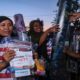Seorang wanita berkerudung menerima paket bantuan untuk NTT yang berisi selimut dan kasa steril