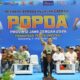 Spanduk pembukaan POPDA Provinsi Jawa Tengah 2026 dengan latar belakang biru dan foto pejabat serta peserta